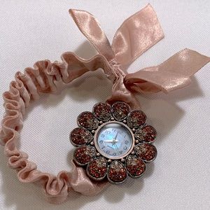 Pink ribbon/stretchy band, with red/pink crystal flower watch face